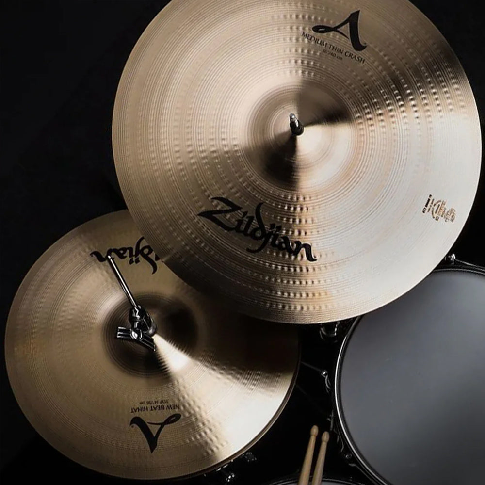 Zilgjian cymbals reflecting light on a drum kit