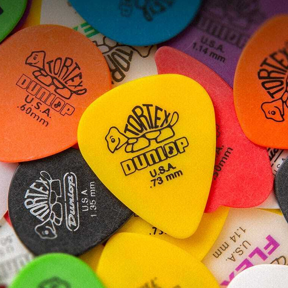 pile of colorful Dunlop guitar picks