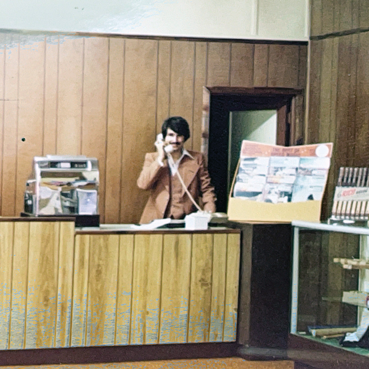 George behind the counter at the original George’s Music location