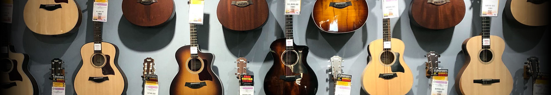 A wall of acoustic guitars at George's Music