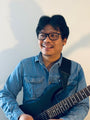 Moses Naing, guitar teacher at George's Music in Jacksonville Beach, FL